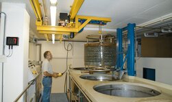 Low headroom hoist GPK with overhead crane system In very tight spaces, a container is moved with a crane system