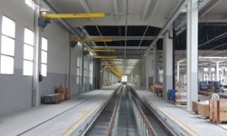 Overhead travelling crane with anti-collision system and crane track monitoring