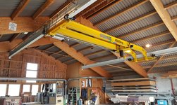 Double girder under girder travelling crane with electric chain hoist in timber construction company