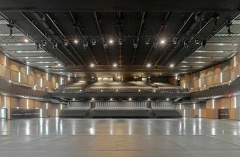 The concert hall with the basic framework of the rigging system with electric chain hoists and motor trolleys