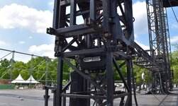 Electric chain hoists with traverse at music festival Stage construction with electric chain hoists at an outdoor music event