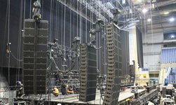 Climbing hoists LP hold loudspeaker system during construction of a concert stage