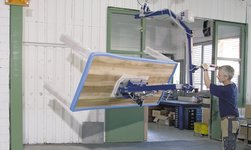 Vacuum handling system is used in carpentry to turn tables